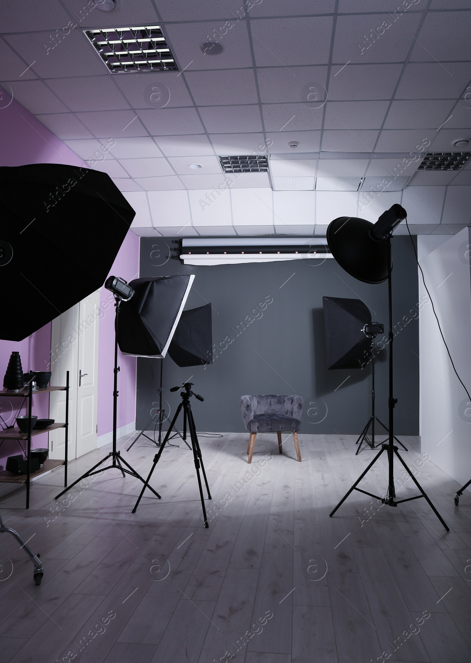 Photo of Interior of modern photo studio with professional equipment