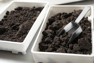 Photo of Containers with soil samples on table, closeup. Laboratory research