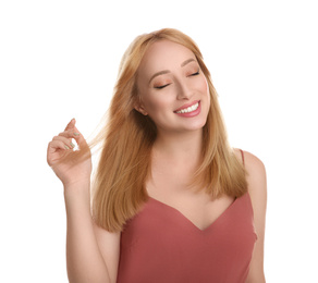 Photo of Portrait of beautiful young woman with blonde hair on white background