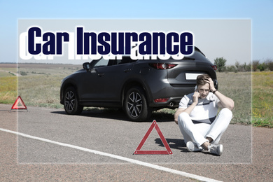 Image of Man talking on phone near broken auto outdoors. Car insurance