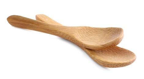 Two new wooden spoons on white background