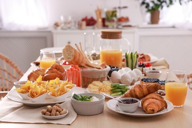 Dishes with different food on table in room. Luxury brunch