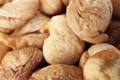 Photo of Tasty figs as background, closeup. Healthy dried fruit