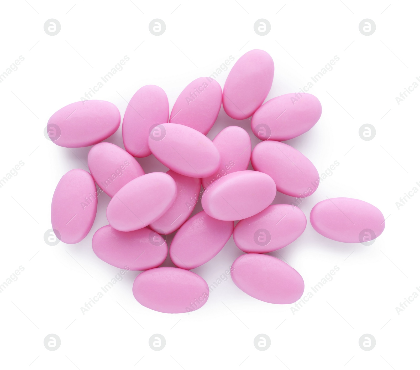 Photo of Tasty pink dragee candies on white background, top view