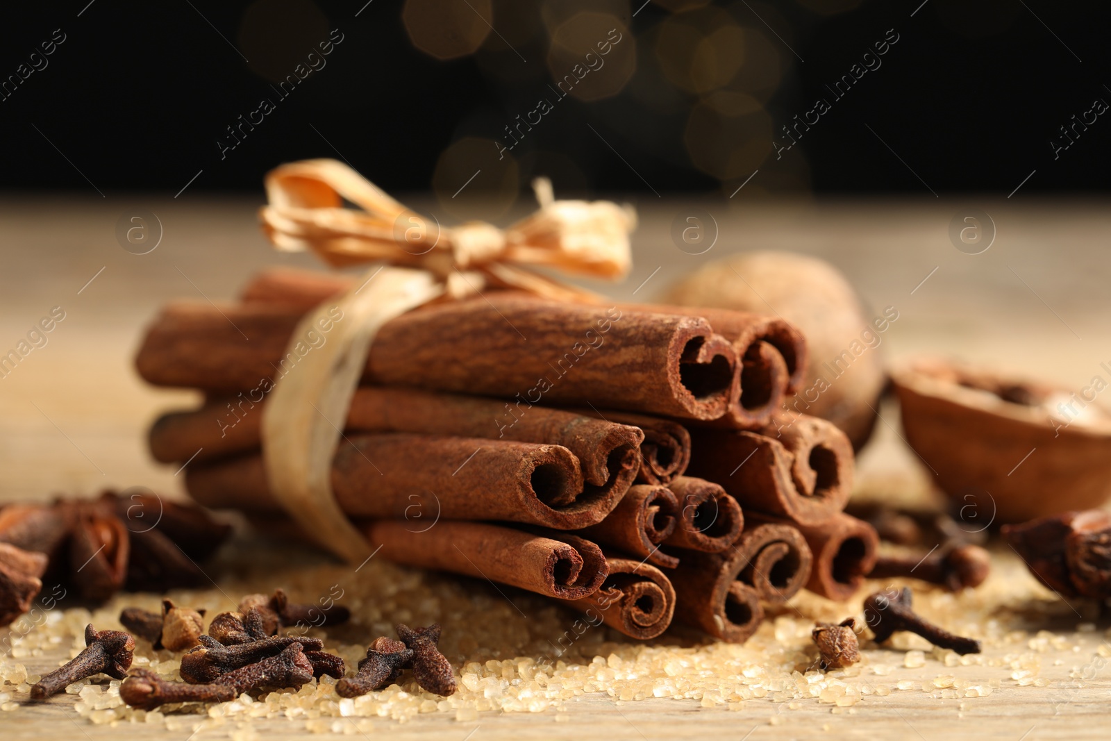 Photo of Different aromatic spices on table, closeup view