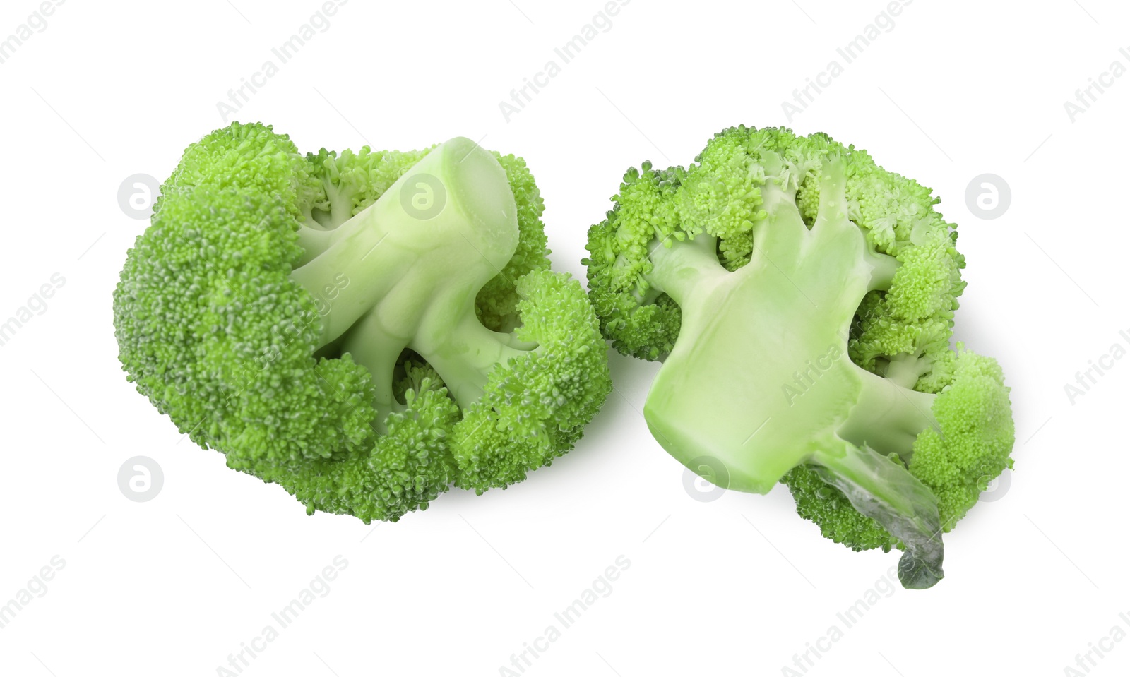 Photo of Cut raw green broccoli isolated on white, top view