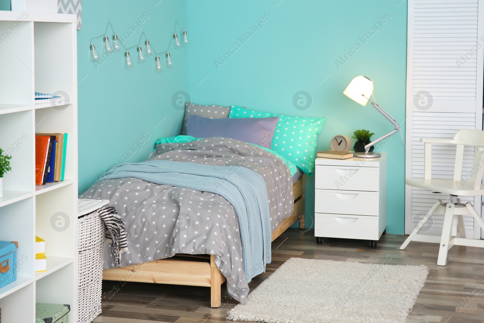 Photo of Comfortable bed in modern children room