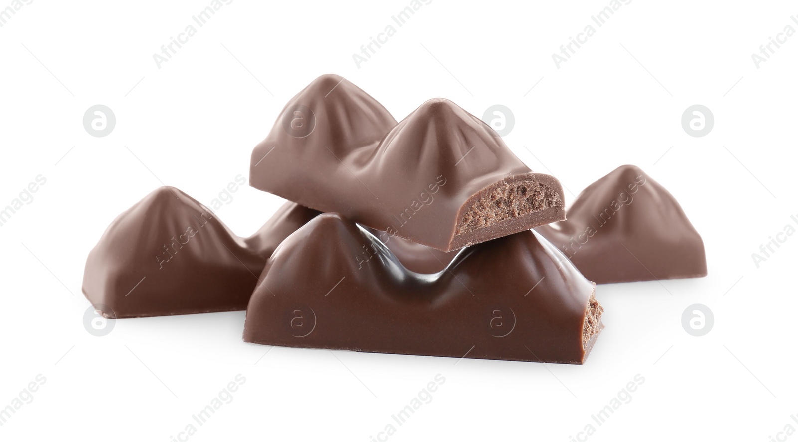 Photo of Pieces of tasty chocolate bars on white background