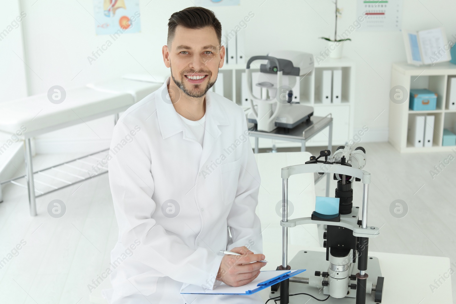 Photo of Ophthalmologist with modern equipment in clinic