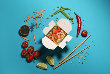 Photo of Box of vegetarian wok noodles with ingredients and chopsticks on turquoise background, flat lay