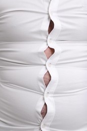 Photo of Man wearing tight shirt, closeup view. Overweight problem
