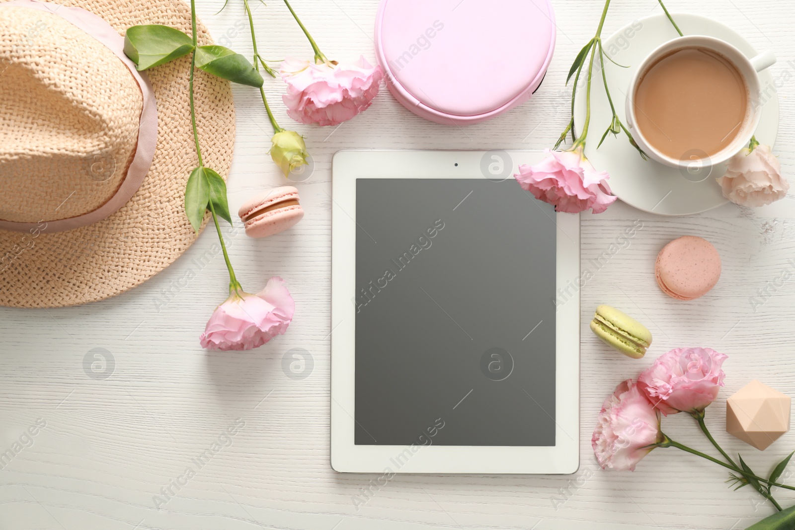 Photo of Flat lay composition with tablet on white wooden table, space for text. Fashion blogger