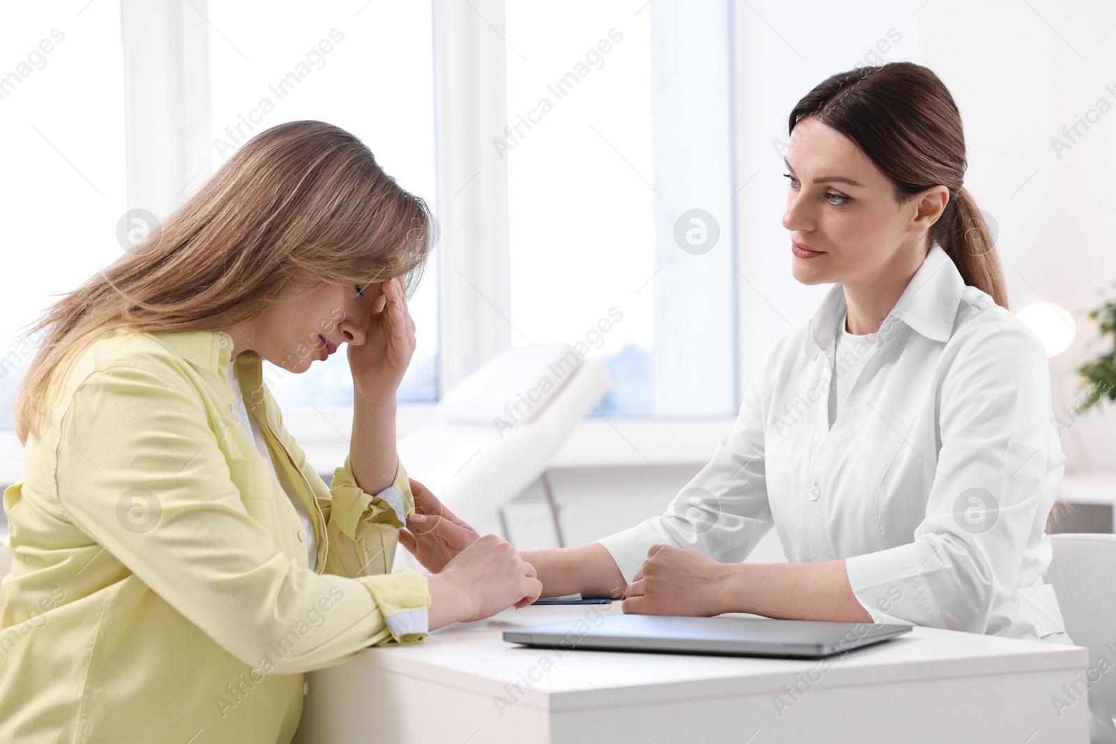 Photo of Mammologist's appointment. Doctor and woman in hospital