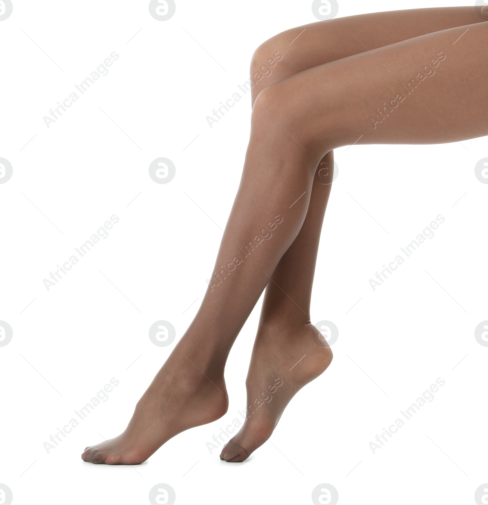 Photo of Legs of beautiful young woman in tights on white background, closeup