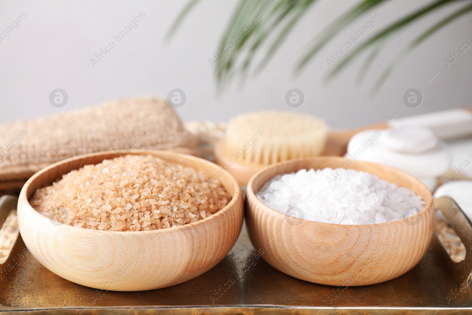 Photo of Salt for spa scrubbing procedure on tray