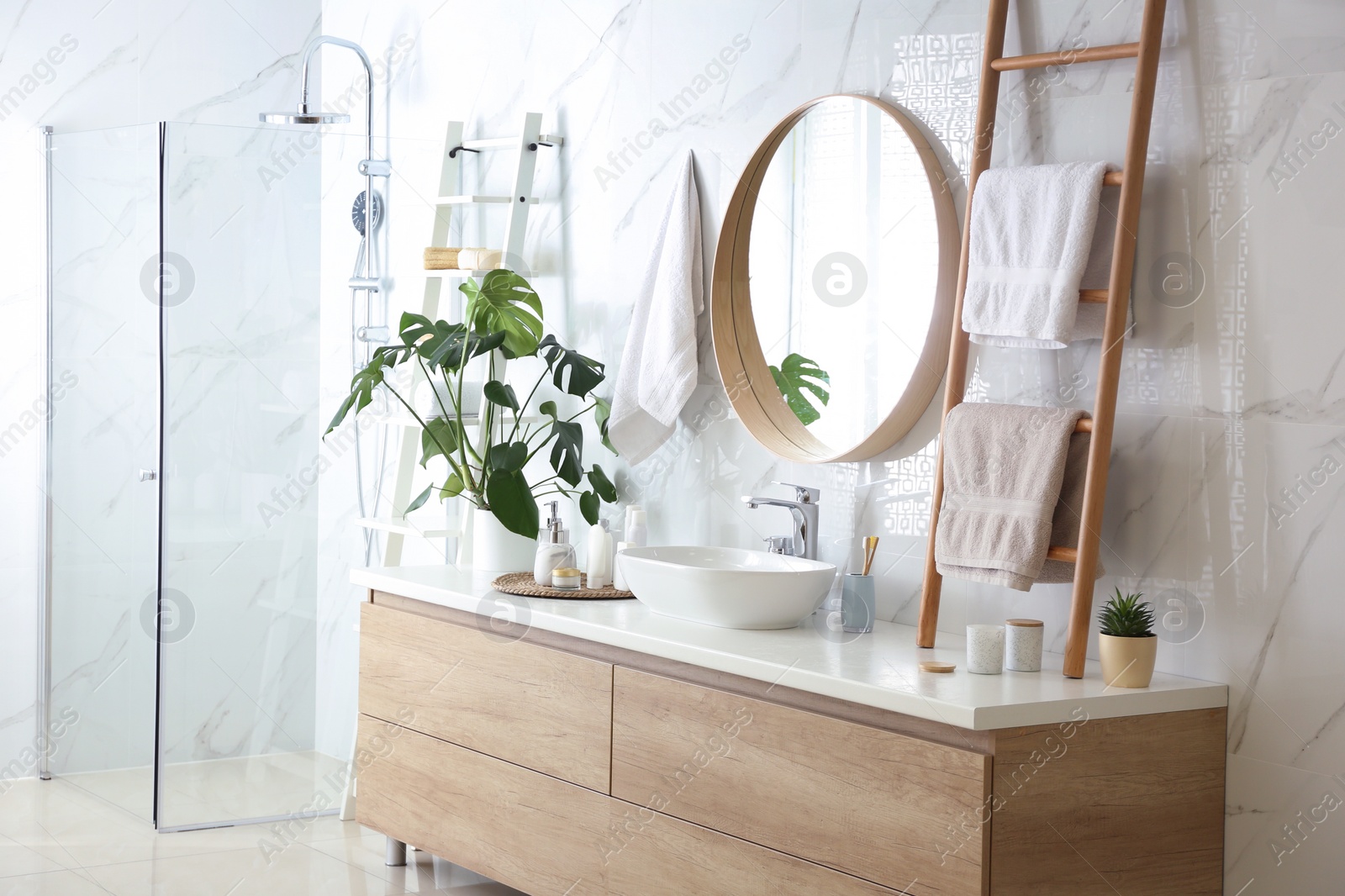 Photo of Decorative ladder near vessel sink in stylish bathroom. Idea for interior design