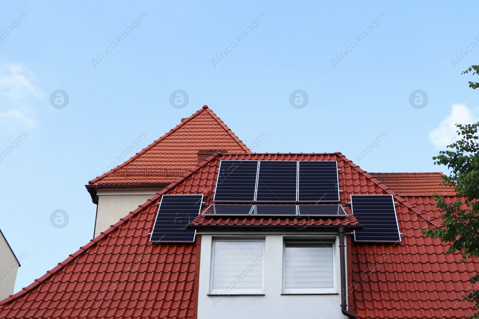 Photo of House with installed solar panels on roof