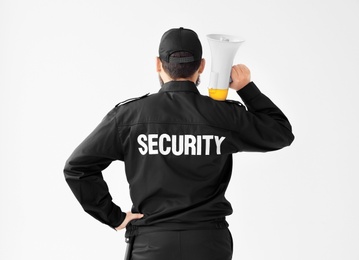 Photo of Security guard with megaphone on white background