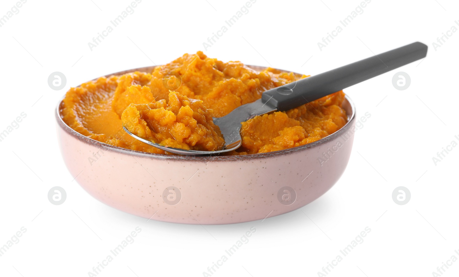 Photo of Delicious vegetable puree and spoon in bowl isolated on white. Healthy food