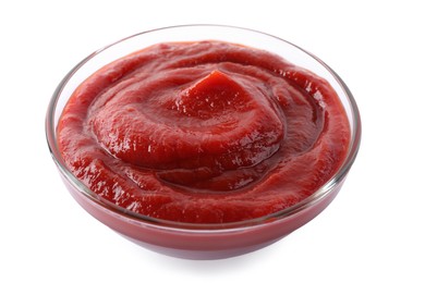 Tasty ketchup in glass bowl isolated on white, closeup