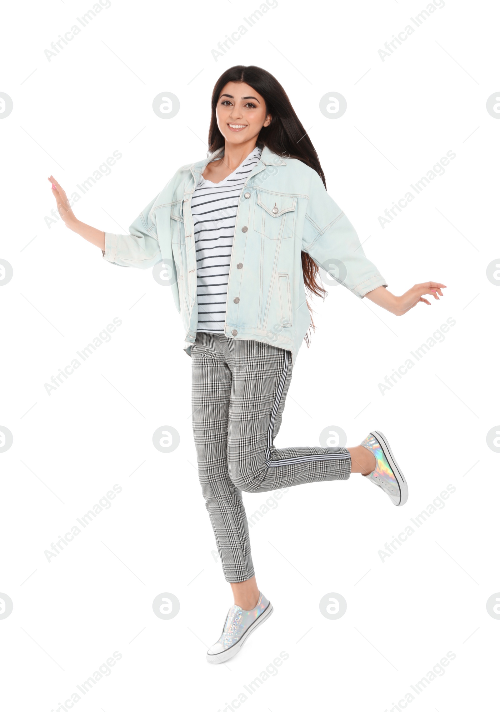 Photo of Full length portrait of jumping young woman on white background
