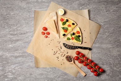 Photo of Flat lay composition with slices of tasty homemade pizza on table