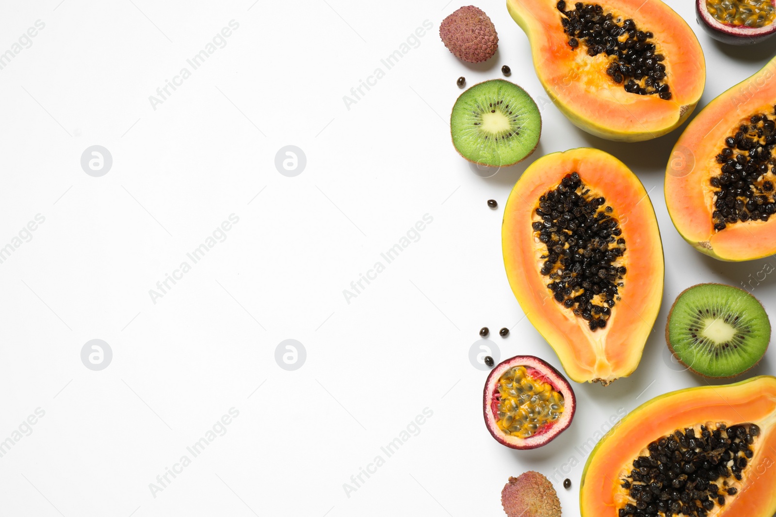 Photo of Fresh ripe papaya and other fruits on white background, top view