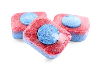 Photo of Three dishwasher detergent tablets on white background