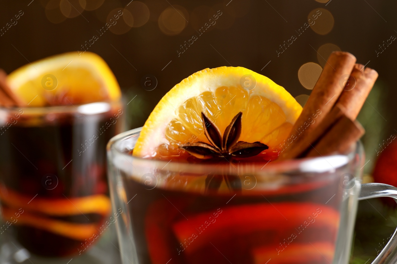 Photo of Glass cup with mulled wine, closeup view