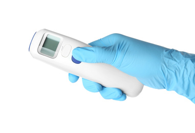 Photo of Doctor in latex gloves holding non-contact infrared thermometer on white background, closeup