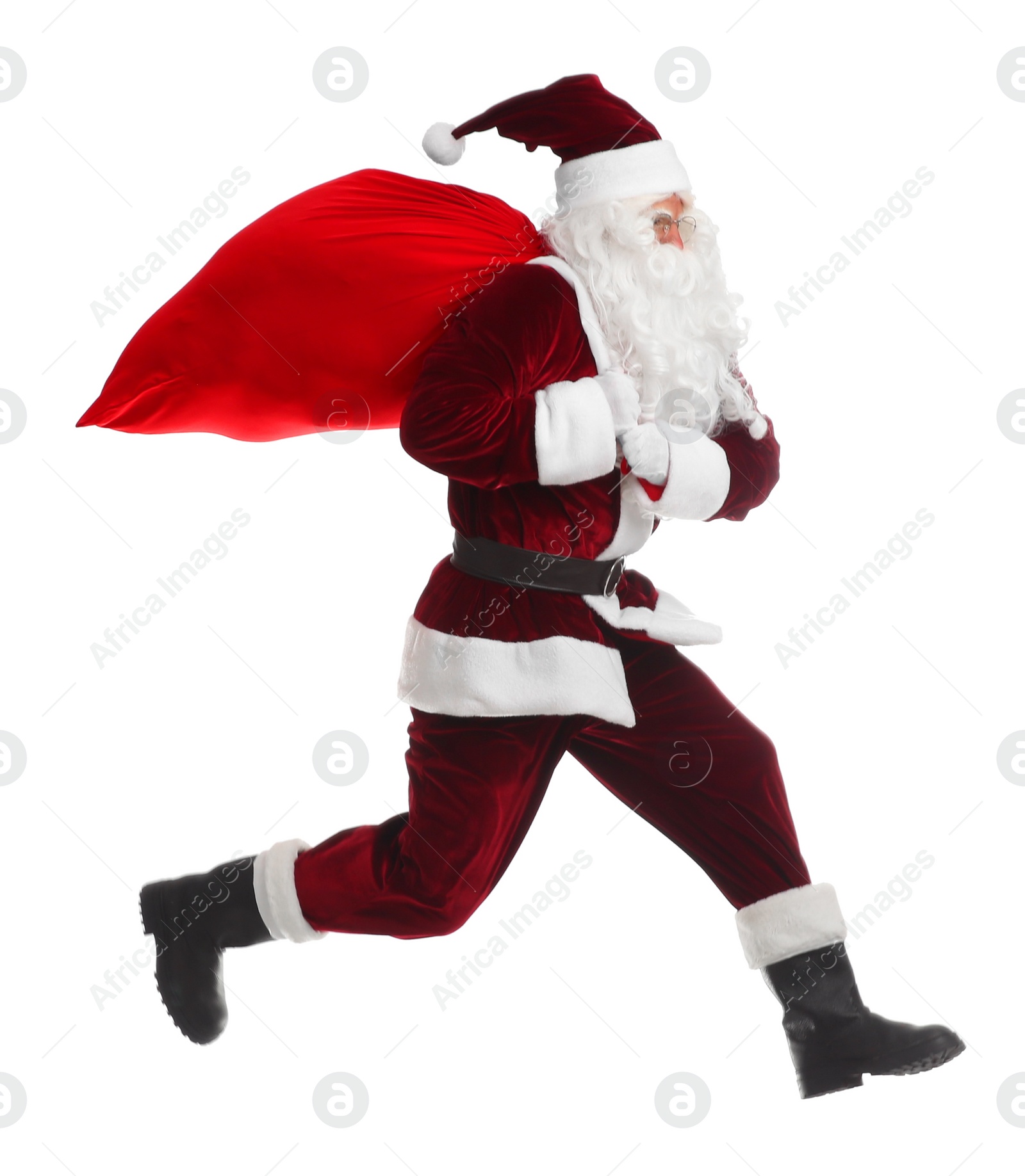 Photo of Santa Claus with red sack jumping on white background