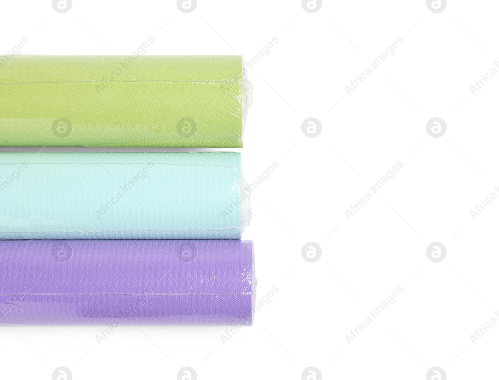 Photo of Colorful wallpaper rolls isolated on white, top view