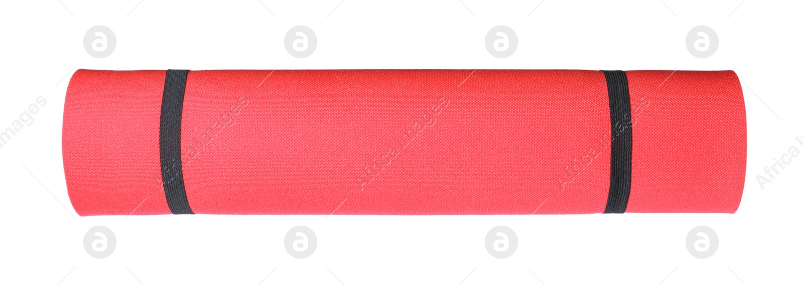 Photo of Red rolled camping or exercise mat on white background, top view