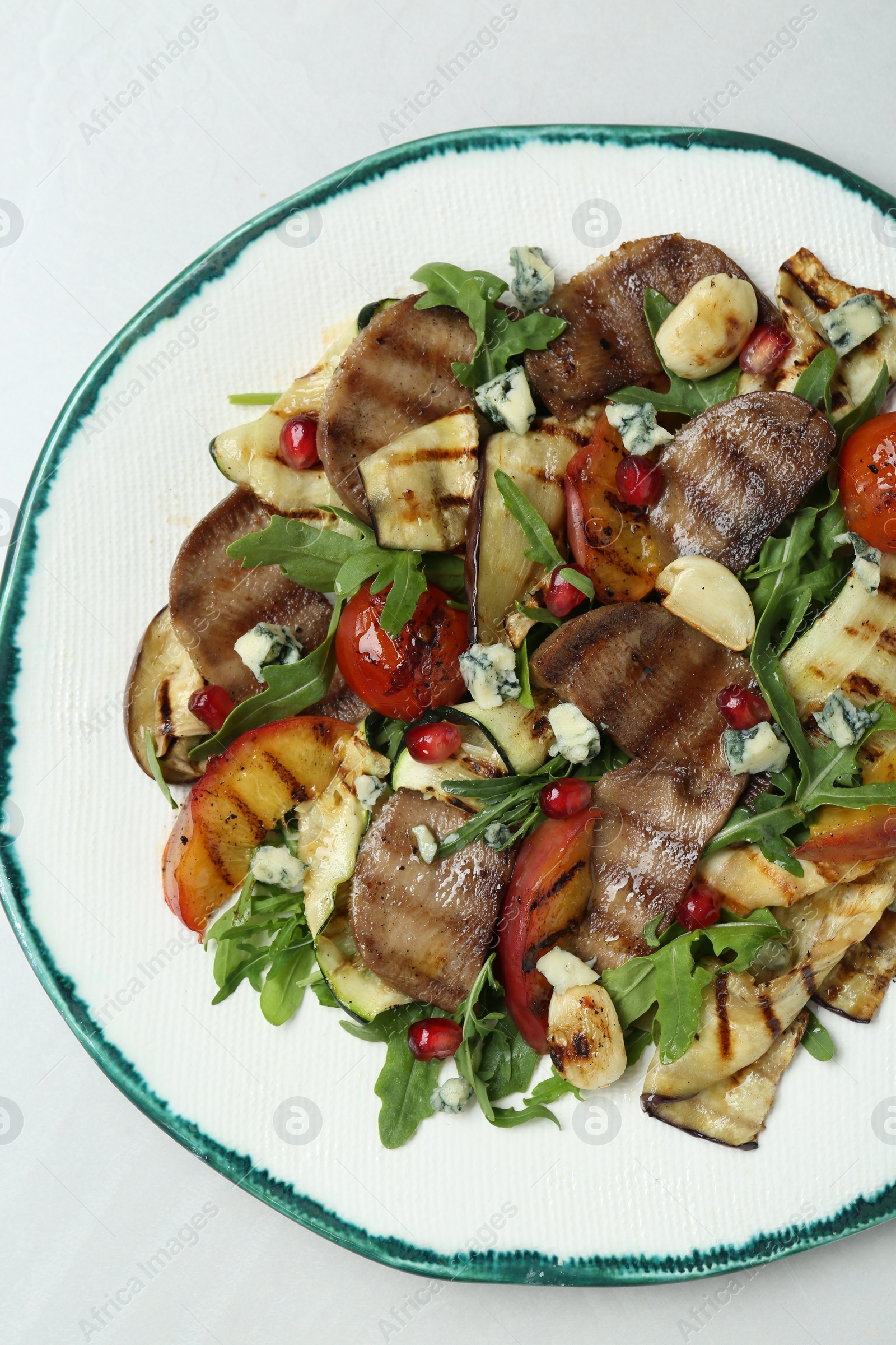 Photo of Delicious salad with beef tongue, grilled vegetables, peach and blue cheese on white table, top view