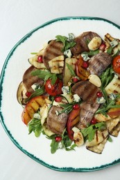 Delicious salad with beef tongue, grilled vegetables, peach and blue cheese on white table, top view