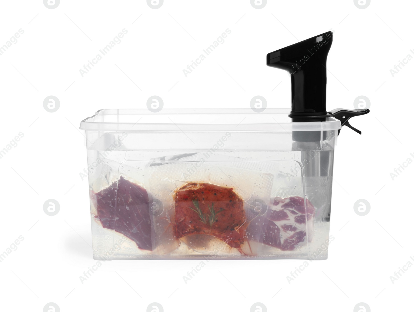Photo of Thermal immersion circulator and meat in box on white background. Vacuum packing for sous vide cooking