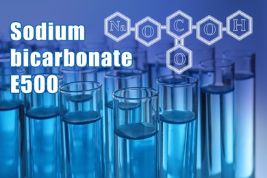 Text Sodium bicarbonate E500 with soda formula and test tubes on background