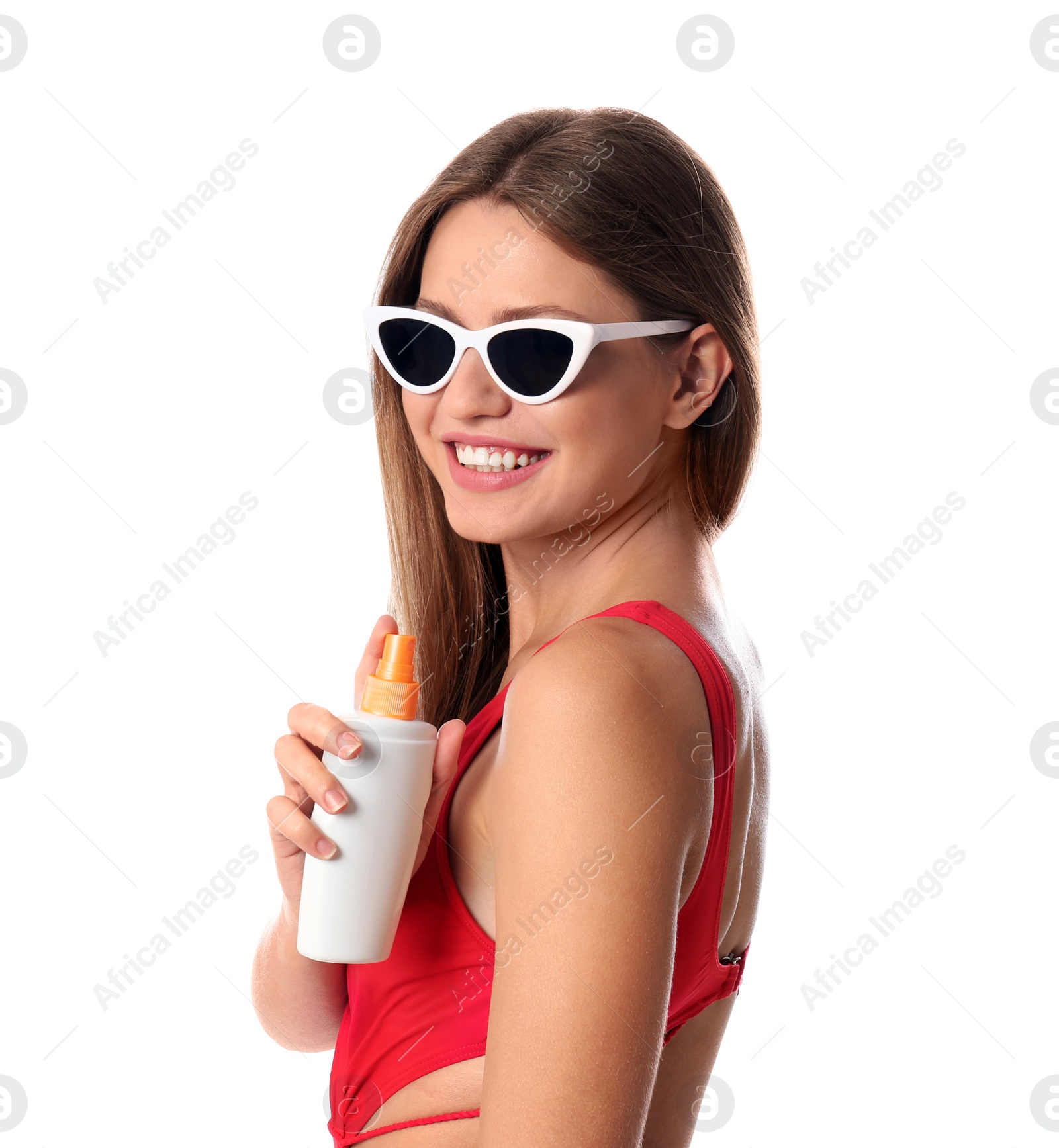 Photo of Woman with bottle of sun protection body cream on white background