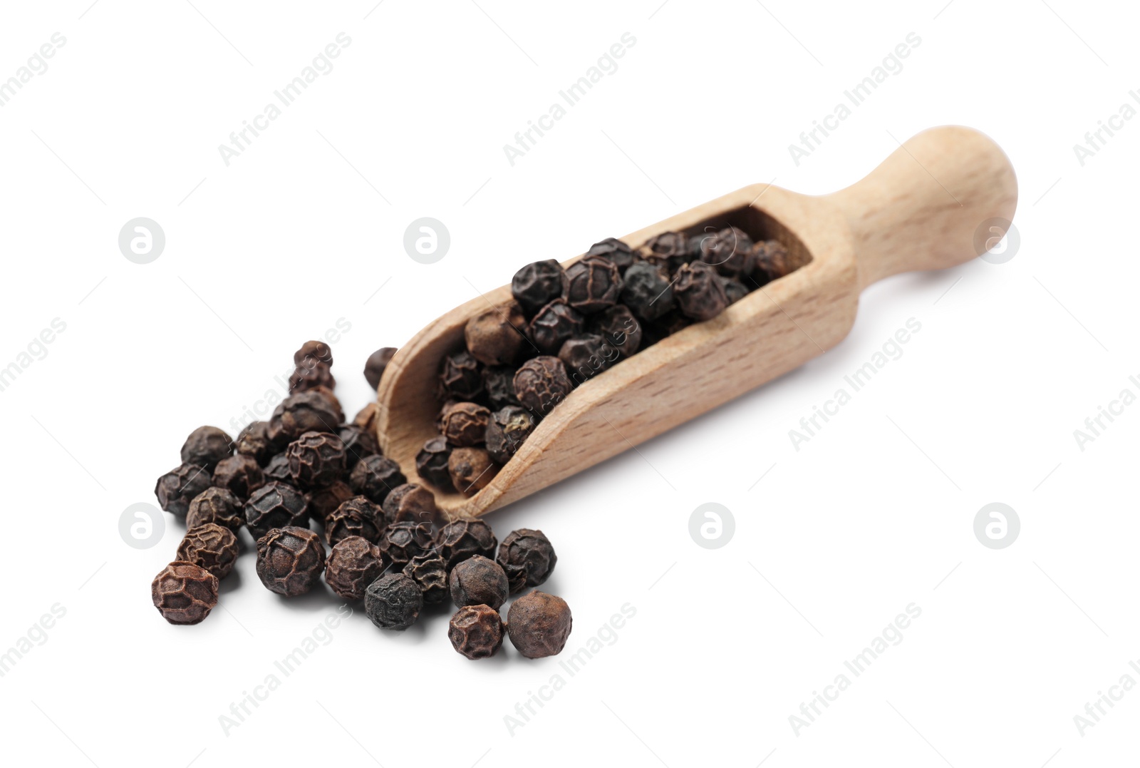 Photo of Aromatic spice. Many black peppercorns in scoop isolated on white