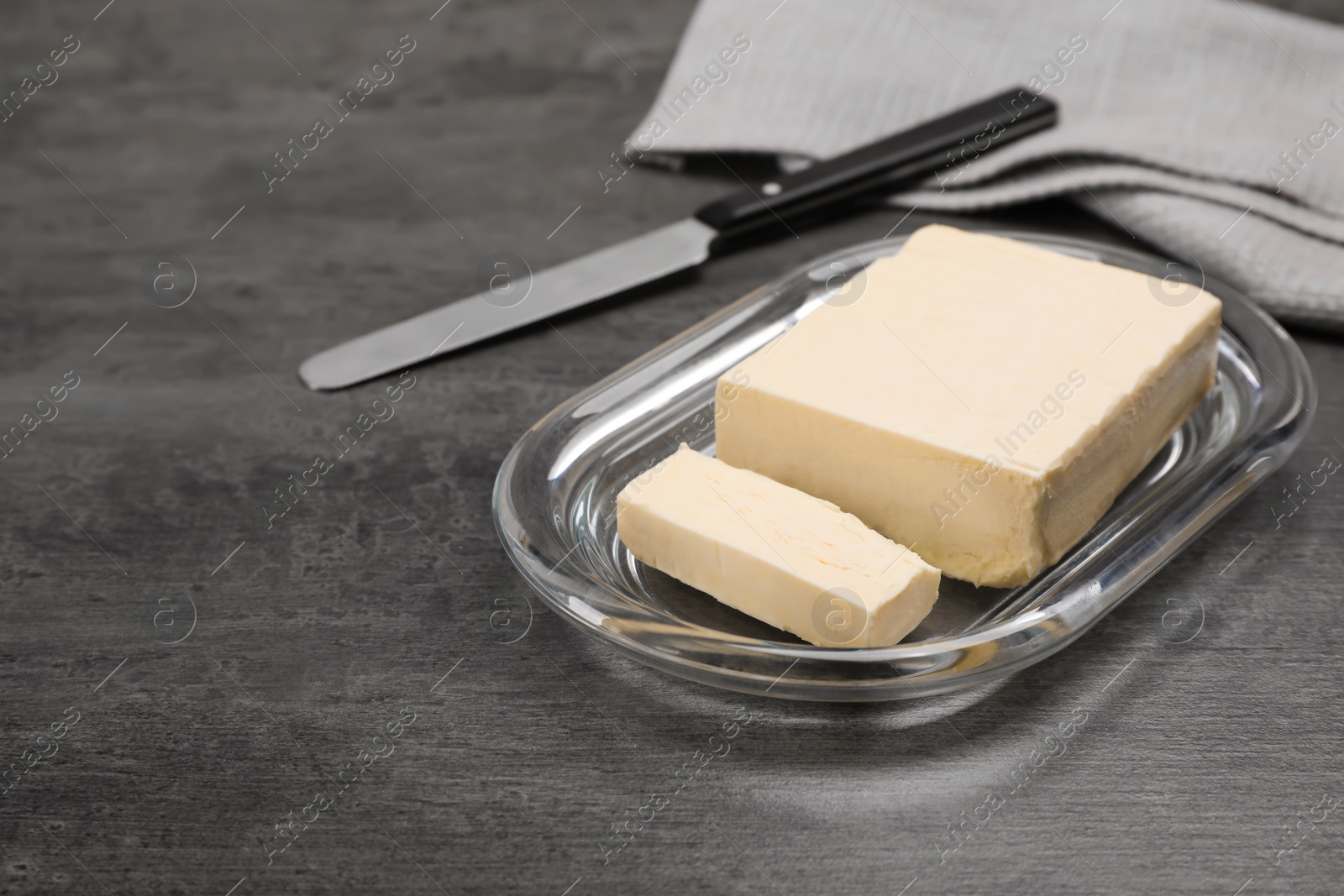 Photo of Plate with tasty fresh butter on table