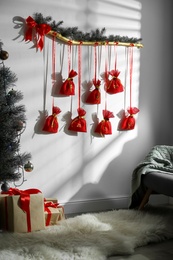 New Year advent calendar hanging on white wall indoors