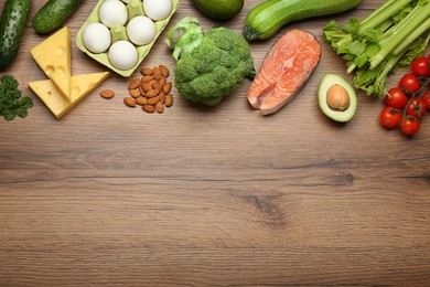 Flat lay composition with fresh organic products on wooden table, space for text. Keto diet