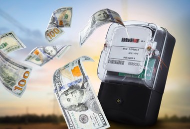 Image of Electricity meters with flying dollar banknotes outdoors at sunset. Paying bills