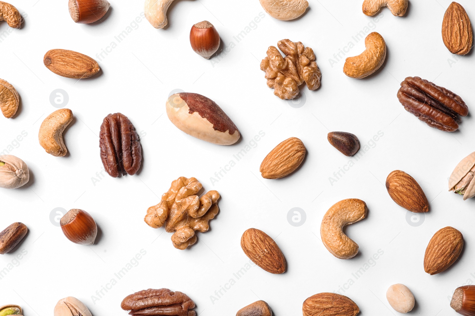 Photo of Composition with organic mixed nuts on white background, top view