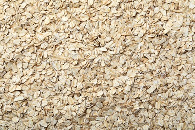 Photo of Pile of oatmeal as background, top view