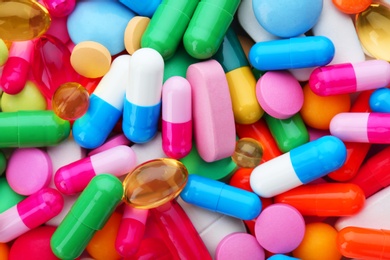 Photo of Assorted pills as background, top view. Medical treatment