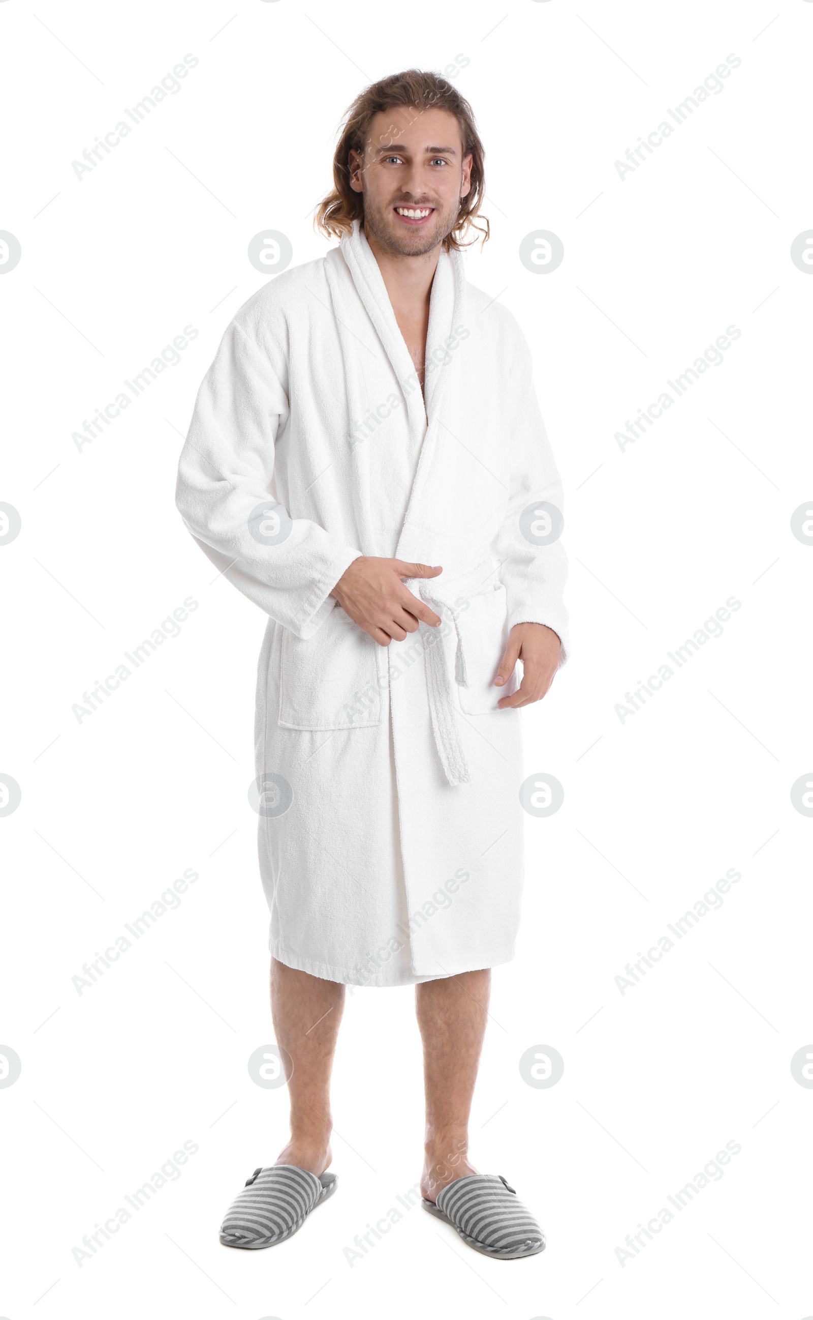 Photo of Young man in bathrobe on white background