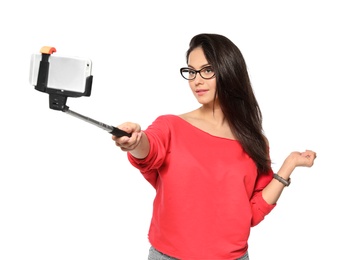 Photo of Attractive young woman taking selfie on white background