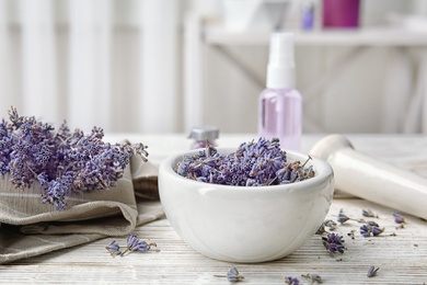 Photo of Composition with lavender flowers and natural cosmetic on table