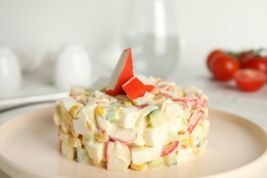 Photo of Delicious salad with fresh crab sticks on plate, closeup